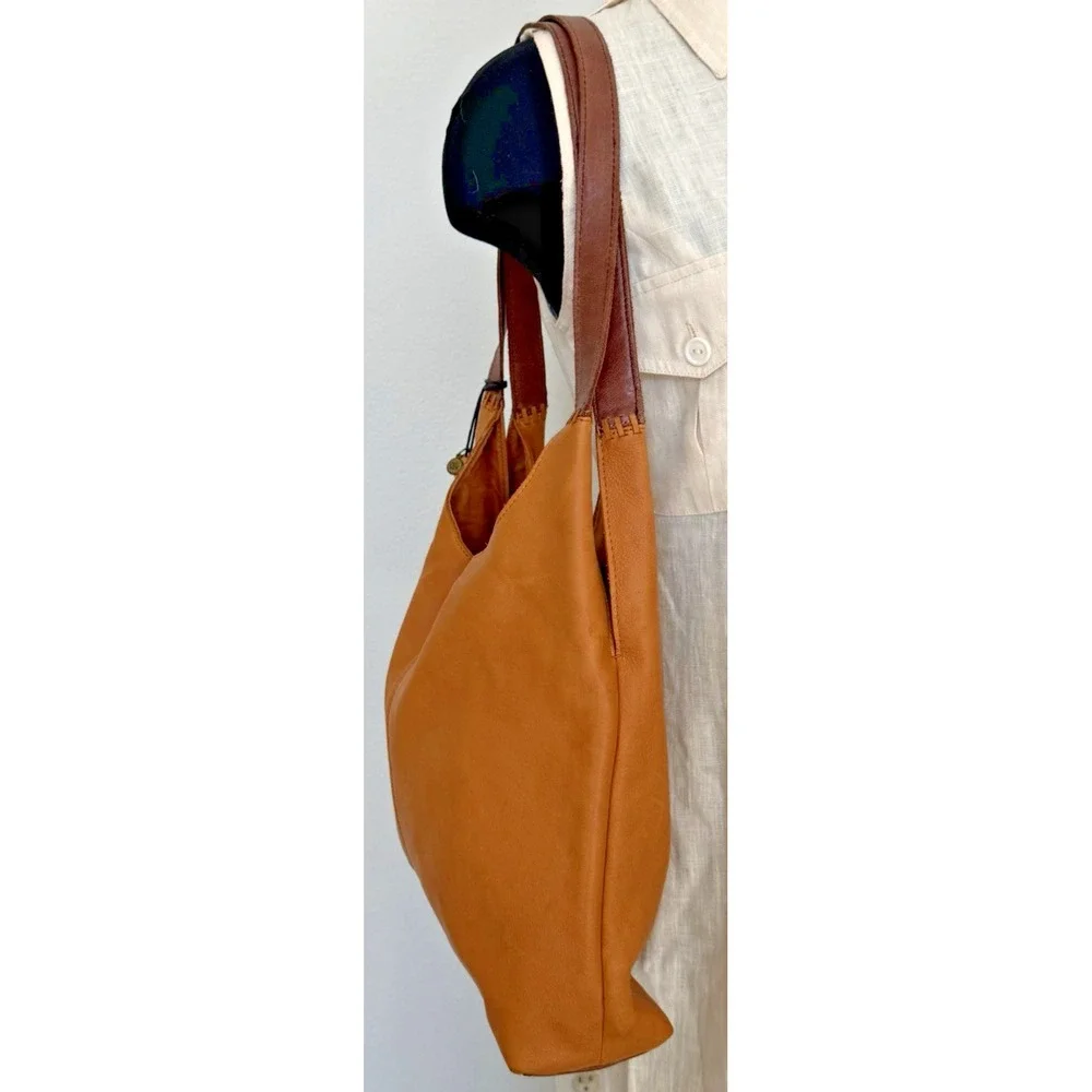 The Sak Women's Huntley‎ Leather Hobo Bag Metro Sling Pebbled Tan with Tassel